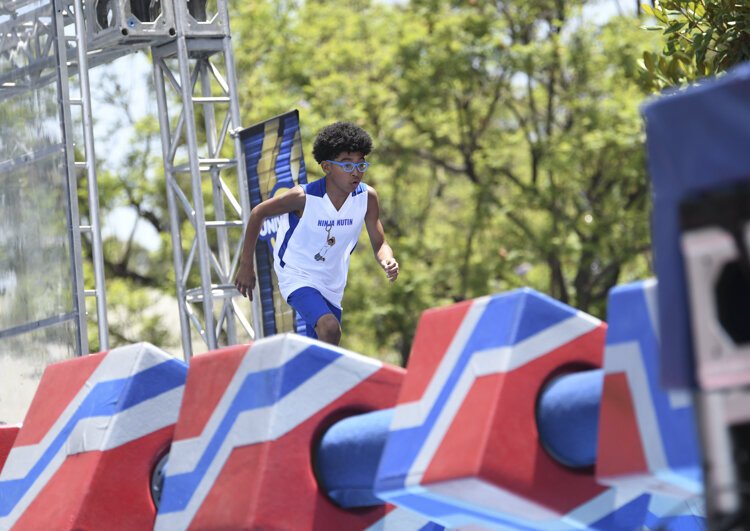 Nathanael Honvou  competing in age group 9-10 on American Ninja Warrior Junior - Season 2.